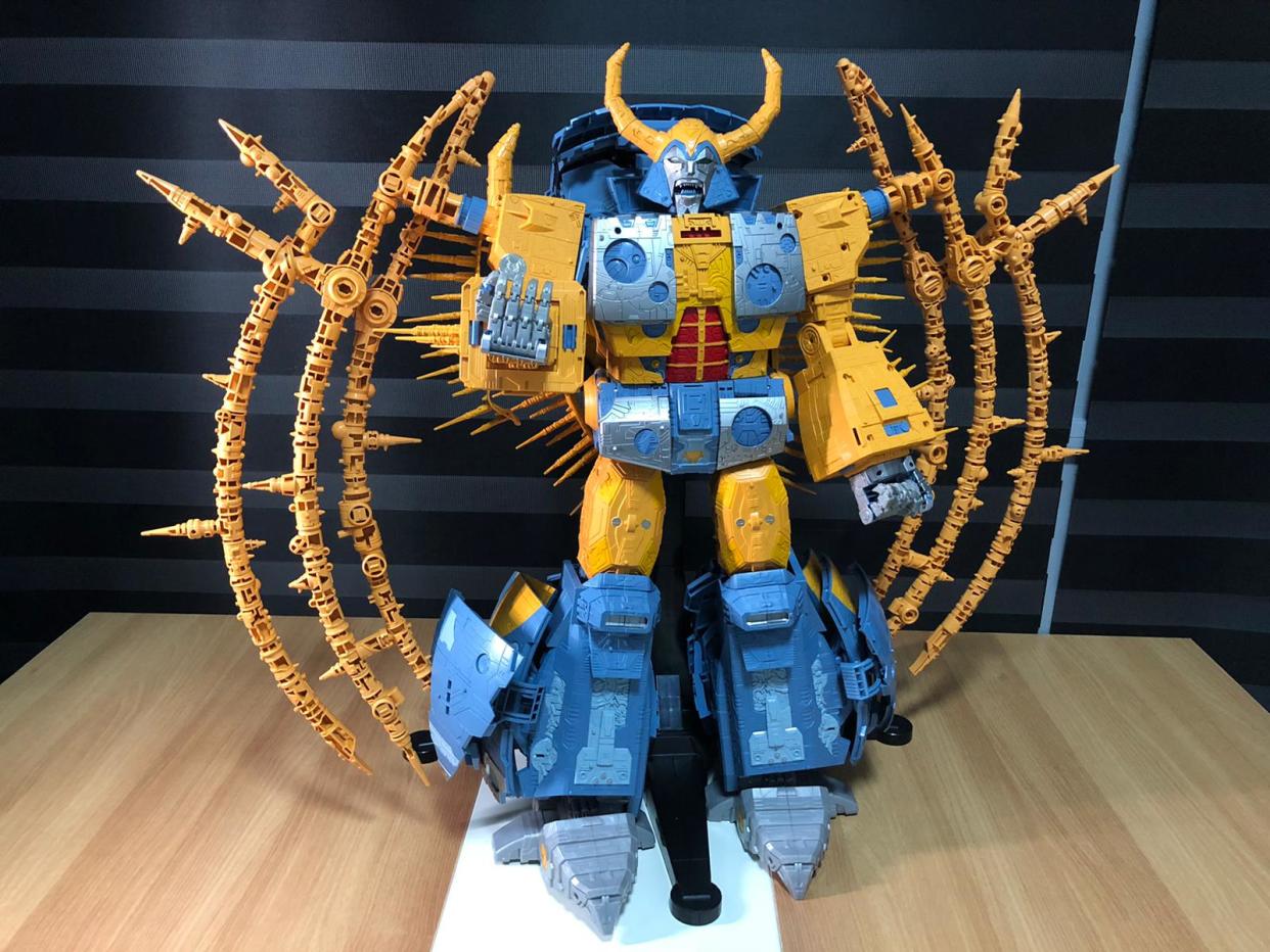 Unicron and a 10-cent coin.
