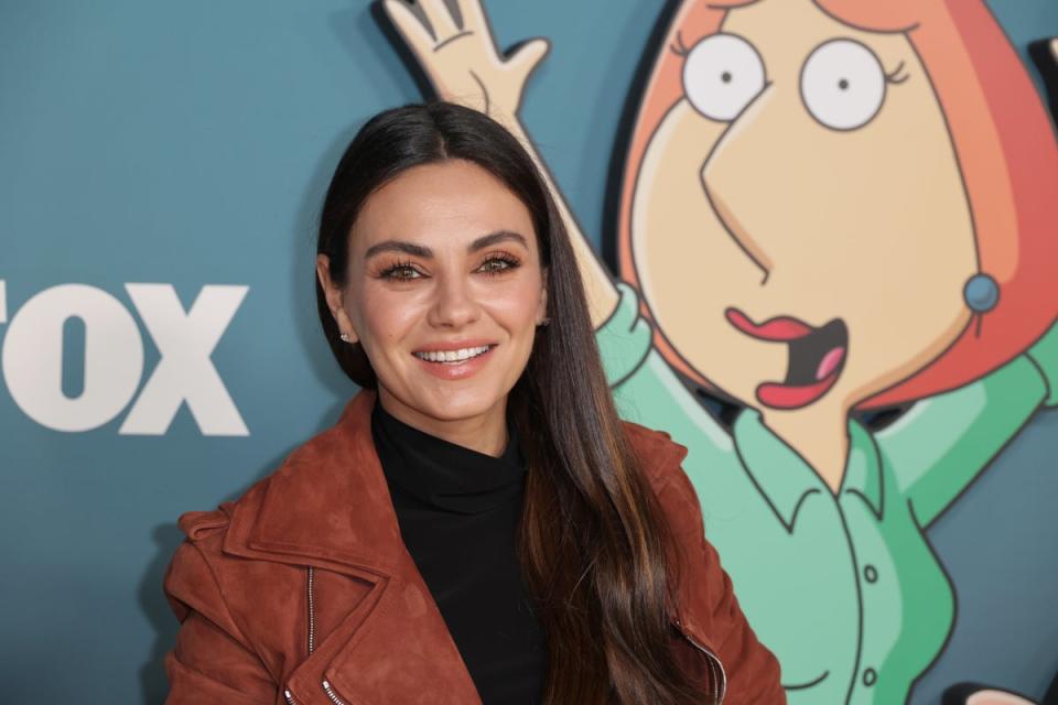 Even Ashton Kutcher’s wife, Mila Kunis, commented on the photos of him and Reese Witherspoon (Getty Images)