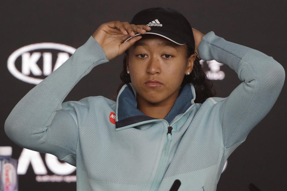 Japan's Naomi Osaka answers questions at a press conference following her win over Karolina Pliskova of the Czech Republic in their semifinal at the Australian Open tennis championships in Melbourne, Australia, Thursday, Jan. 24, 2019. (AP Photo/Mark Schiefelbein)