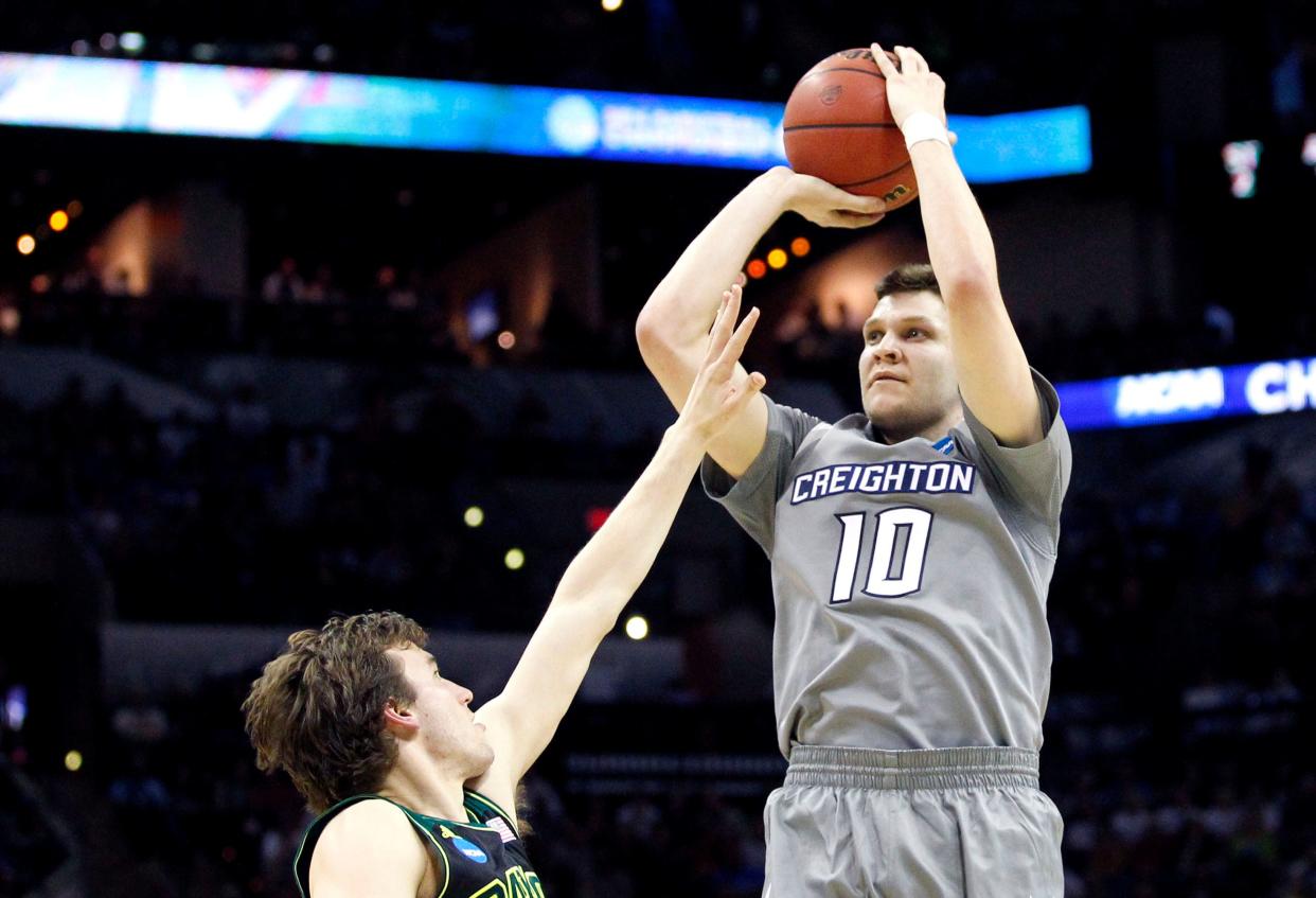 Mar 23, 2014; San Antonio, TX, USA; Creighton Bluejays guard Grant Gibbs (10) shoots over Baylor Bears guard Brady Heslip (5) in the first half of a men's college basketball game during the third round of the 2014 NCAA Tournament at AT&T Center. Mandatory Credit: Soobum Im-USA TODAY Sports