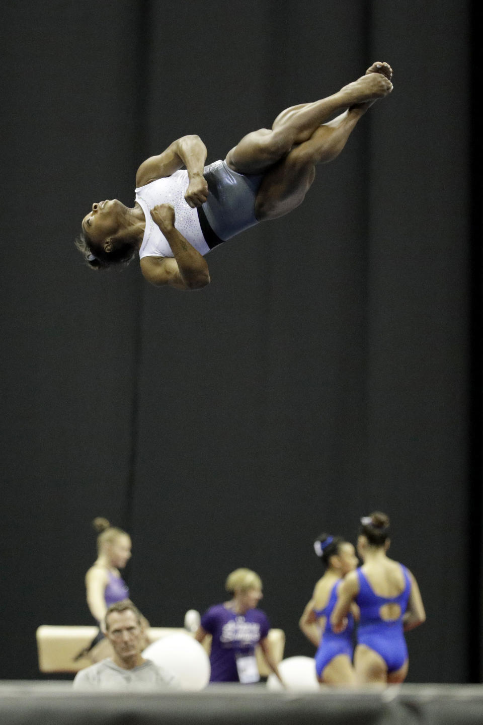 Simone Biles works on her floor exercise routine during practice for the U.S. Gymnastics Championships Wednesday, Aug. 7, 2019, in Kansas City, Mo. (AP Photo/Charlie Riedel)
