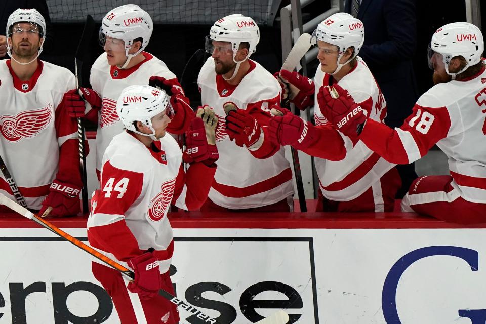 Red Wings defenseman Christian Djoos celebrates with teammates after scoring a goal against the Blackhawks during the second period Saturday.