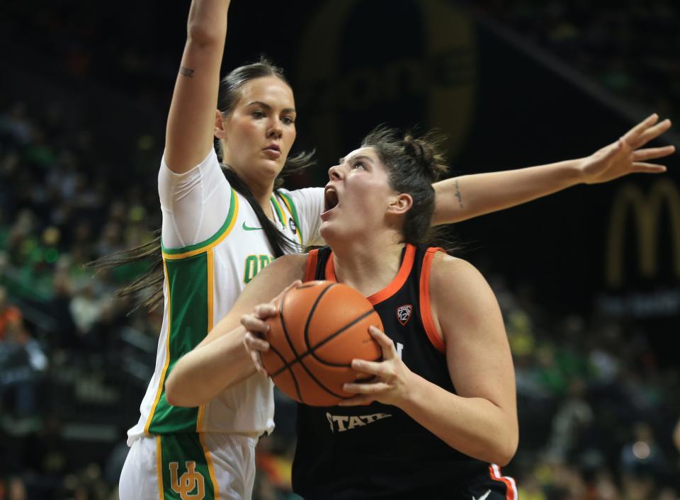 Oregon State’s Raegan Beers, right, battles Oregon’s Kennedy Basham for position under the basket during the first half at Matthew Knight Arena Sunday, Feb 4, 2024.