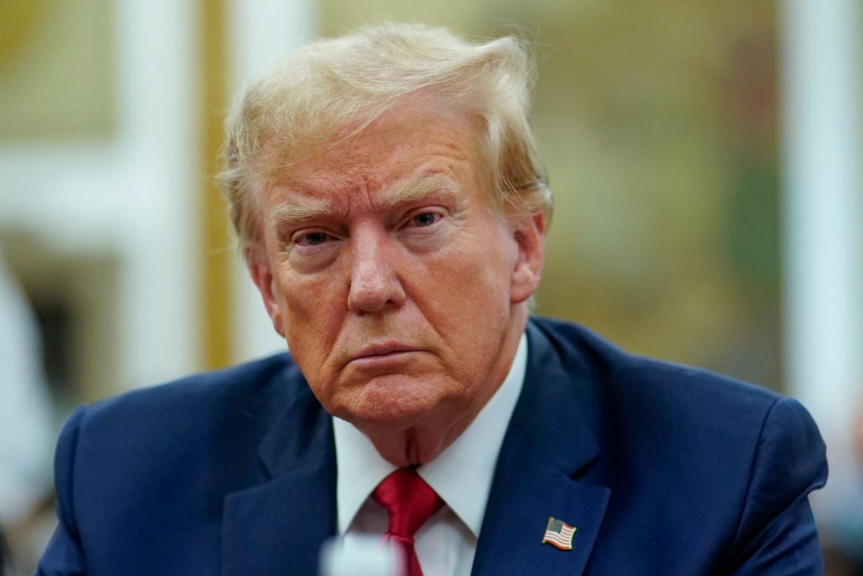 Former US President Donald Trump arrives at the New York State Supreme Court during the civil fraud trial against the Trump Organization, in New York City on December 7, 2023.