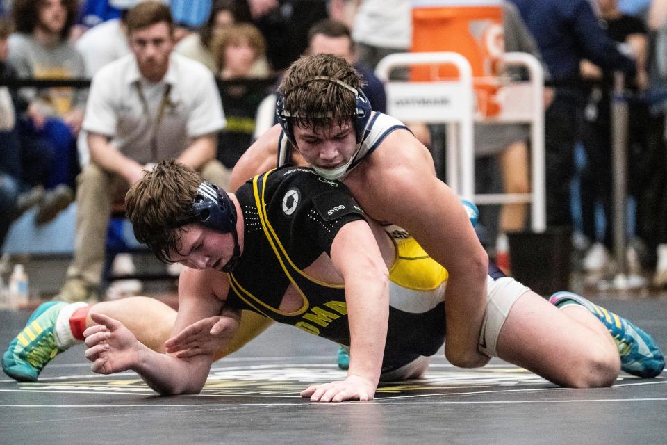 Salesianum senior Max Agresti, at top, wrestles Delaware Military Academy senior Tyler August to win the 1st Place Match during the 215 pounds championship finals of the DIAA Individual Wrestling State Tournament at Cape Henlopen High in Lewes, Saturday, March 4, 2023.