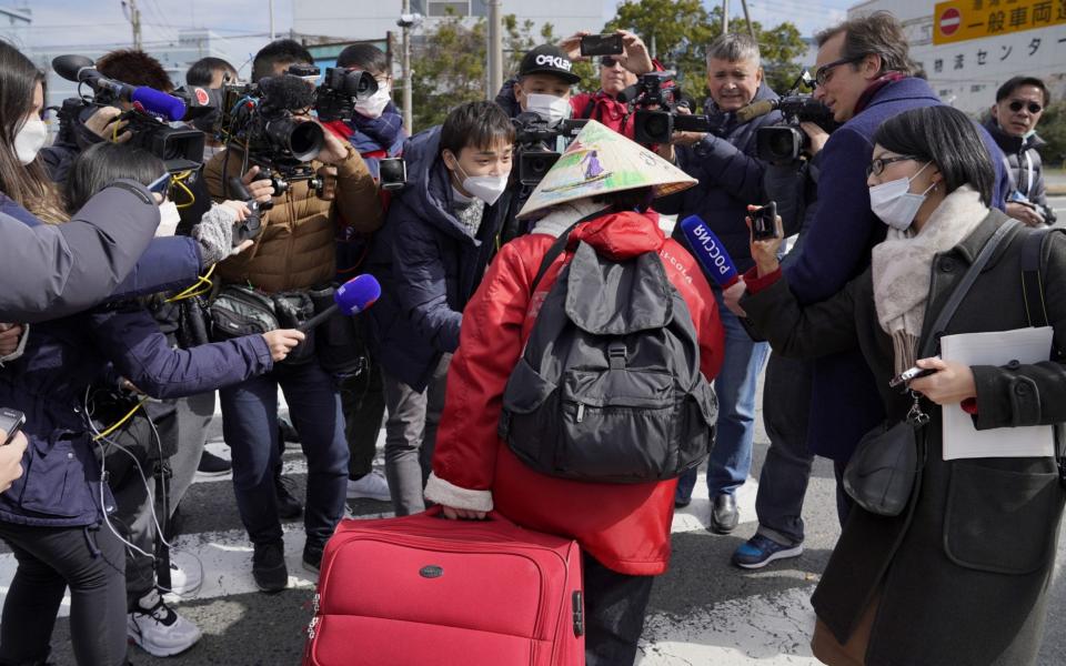 First passengers of quarantined cruise ship disembark, in Japan, Yokohama - Rex