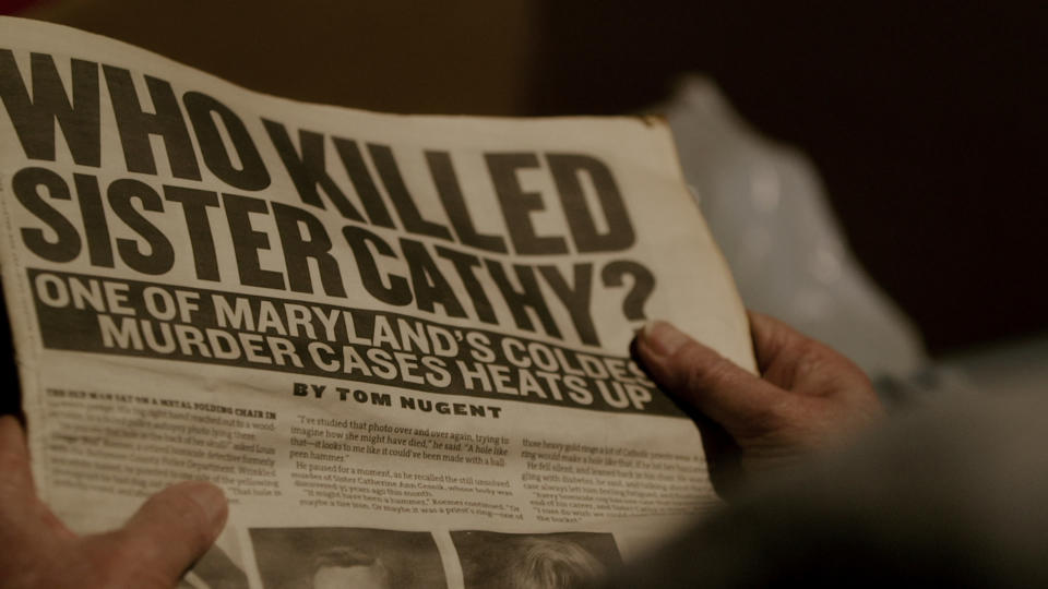 A newspaper reading "WHO KILLED SISTER CATHY?"