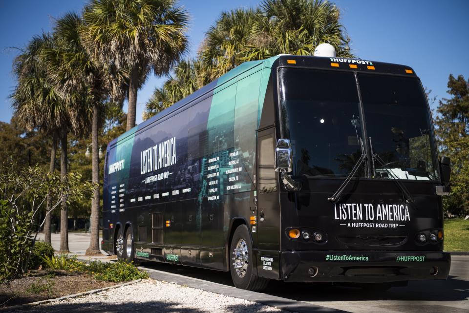 The tour bus sits among palm trees in New Orleans