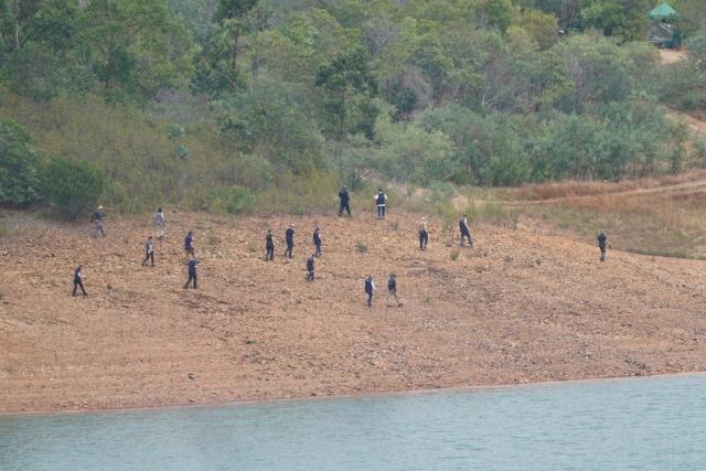 Officers taking part in the search at the Barragem do Arade reservoir on Tuesday (PA)