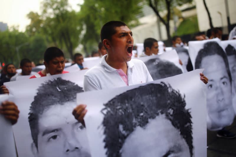 Relatives of the 43 missing students of the Ayotzinapa Teacher Training College march on the 6th anniversary of their disappearance, in Mexico City