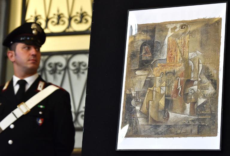 A Picasso painting described as being a 1912 work from the artist's Cubist period is displayed during a press conference in Rome on March 27, 2015 after Italian police seized it