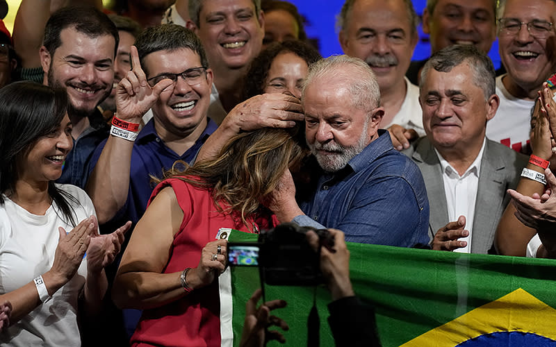 Former Brazilian President Luiz Inácio Lula da Silva embraces his wife, Rosangela, after defeating incumbent Jair Bolsonaro in a presidential runoff to become the country’s next president in Sao Paulo on Oct. 30. <em>Associated Press/Andre Penner</em>