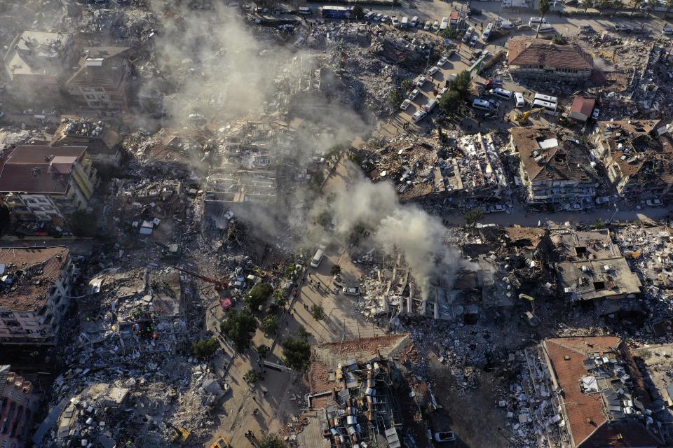 Destroyed buildings are seen from above in Antakya, southeastern Turkey, Thursday, Feb. 9, 2023. Thousands who lost their homes in a catastrophic earthquake huddled around campfires and clamored for food and water in the bitter cold, three days after the temblor and series of aftershocks hit Turkey and Syria. (AP Photo/Hussein Malla)