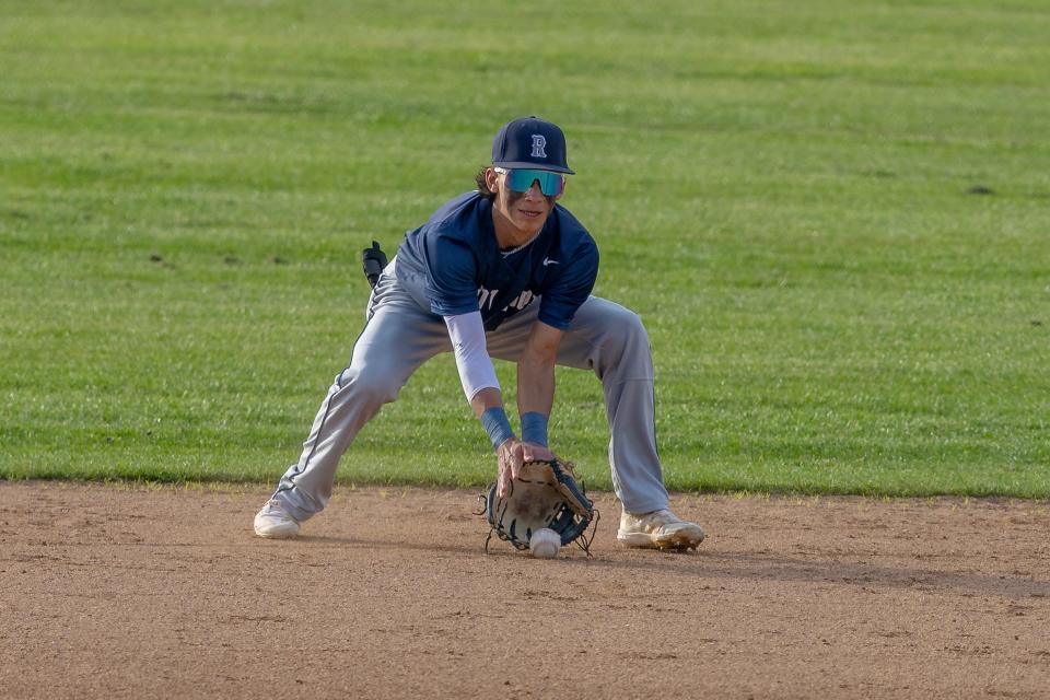 Redwood's Isaac Esquivel makes the play at shortstop during the East Yosemite League high school baseball game against El Diamante on Wednesday, March 13, 2024 at El Diamante High School.