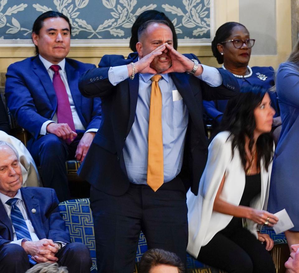 A protester shouts as President Joe Biden delivers the State of the Union address to Congress at the U.S. Capitol in Washington on March 7, 2024.