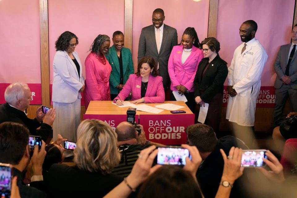Michigan Gov. Gretchen Whitmer signs legislation to repeal the 1931 abortion ban statute, which criminalized abortion in nearly all cases during a bill signing ceremony, Wednesday, April 5, 2023, in Birmingham, Mich. The abortion ban, which fueled one of the largest ballot drives in state history, had been unenforceable after voters enshrined abortion rights in the state constitution last November. (AP Photo/Carlos Osorio)