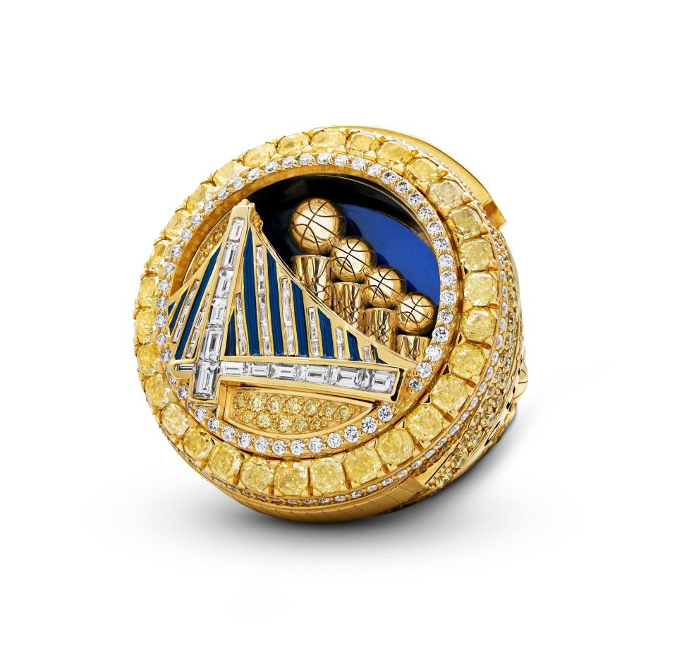 The top of the Warriors' 2022 NBA championship rings, with compartment showing individual trophies won exposed.