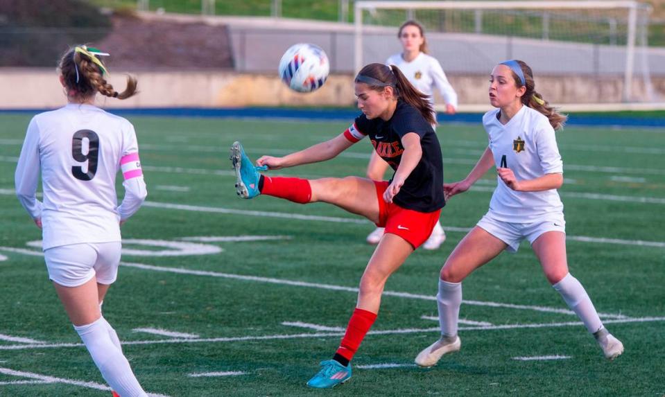 Oakdale High’s Mia Peterson, 3, kicks the ball over her head during the Sac-Joaquin Section Division III Section Championship match against Rio Americano Thursday Feb. 22, 2024 at Cosumnes River College.