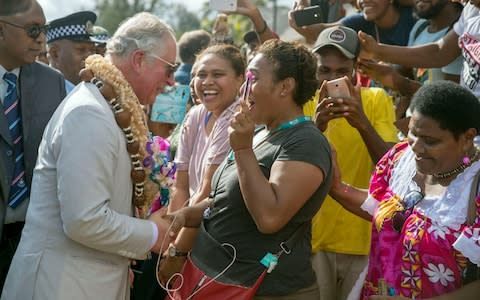 The prince greets a lady during a visit to Haos blong Handikraf, as he visits the South Pacific island of Vanuatu, during his tour of the region - Credit: Steve Parsons/PA Wire