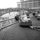 <p>Two women enjoy a ride on one of the carnival rides at Coney Island. </p>