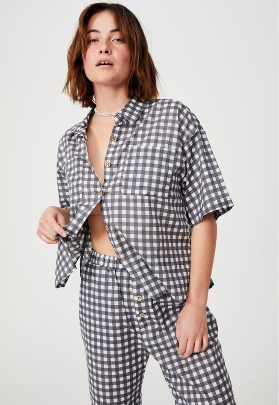 Black and white checked pyjama pants and matching button down top