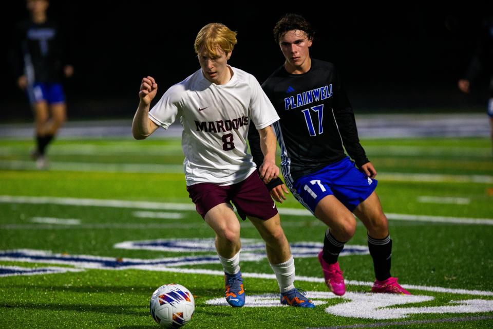 Holland Christian's Lukas Hegg takes the ball down the field during a game against Plainwell Thursday, Oct. 26, 2023, at Gull Lake High Shcool.