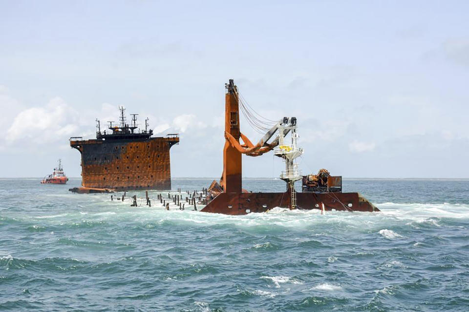 This photo provided by Sri Lankan Navy shows the sinking MV X-Press Pearl off Colombo port, Sri Lanka, Thursday, June 17, 2021. The container ship carrying chemicals sank off Sri Lanka’s capital on Thursday nearly a month after catching fire, raising concerns about a possible environmental disaster. The ship's operator said the wreck of the Singapore-flagged X-Press Pearl "is now wholly sitting on the seabed at a depth of 21 meters (70 feet).” (Sri Lanka Navy via AP)