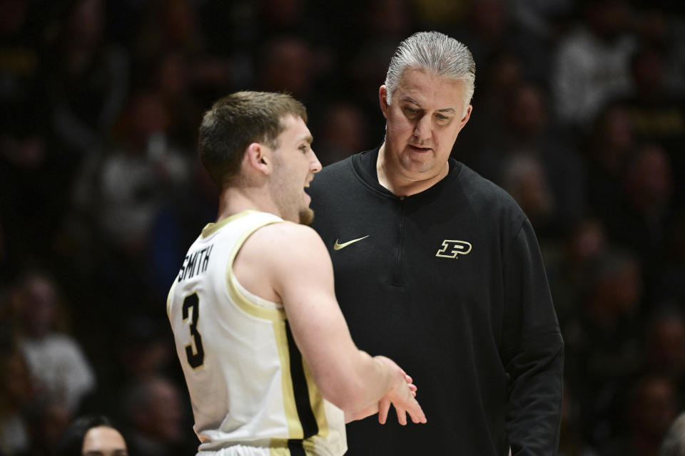 Purdue coach Matt Painter talks with guard Braden Smith during the first half of the team's NCAA college basketball game against Eastern Kentucky, Friday, Dec. 29, 2023, in West Lafayette, Ind. (AP Photo/Marc Lebryk)