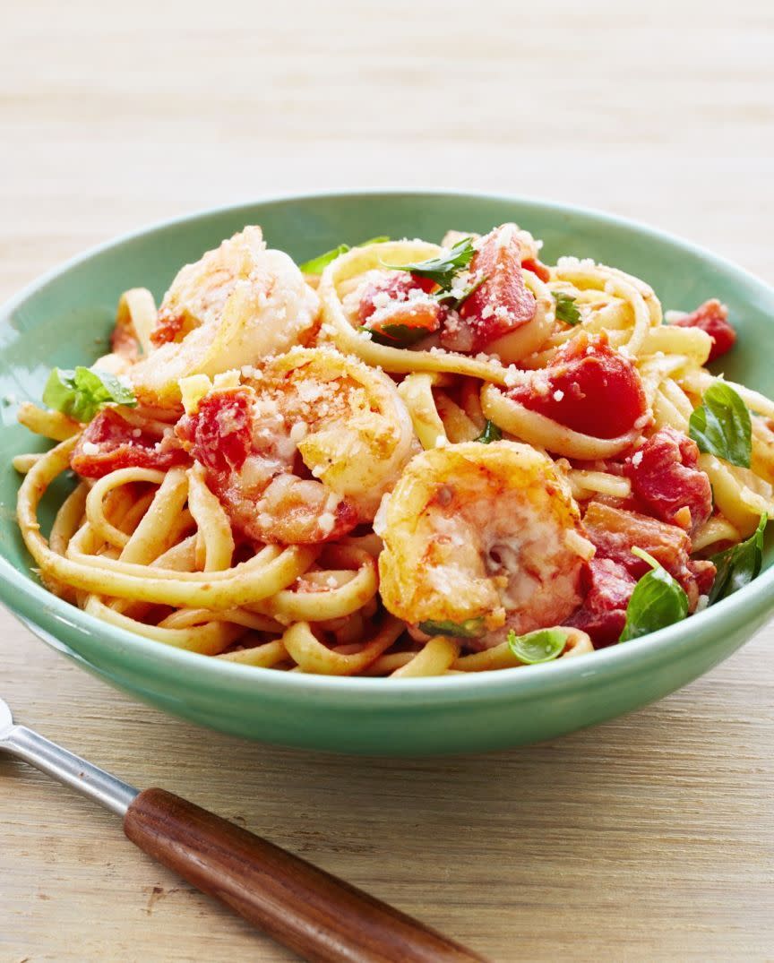 foil packet shrimp pasta in green bowl