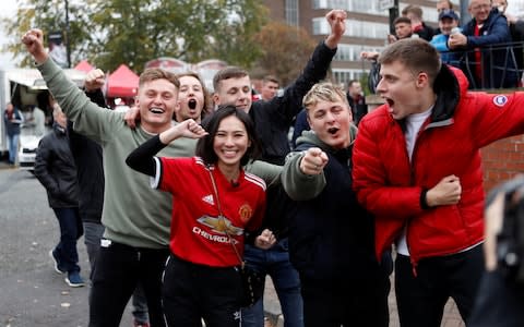Manchester United fans outside the ground - Credit: Reuters