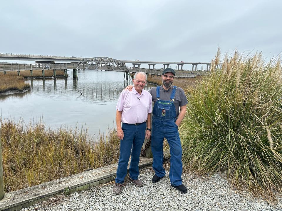 Former Mayor and councilman Douglas Medlin, left, and his son Chris Medlin, on left, are both lifelong Surf City residents. Chris Medlin's business East Coast Sports overlooks the new Surf City Bridge that his father advocated for.