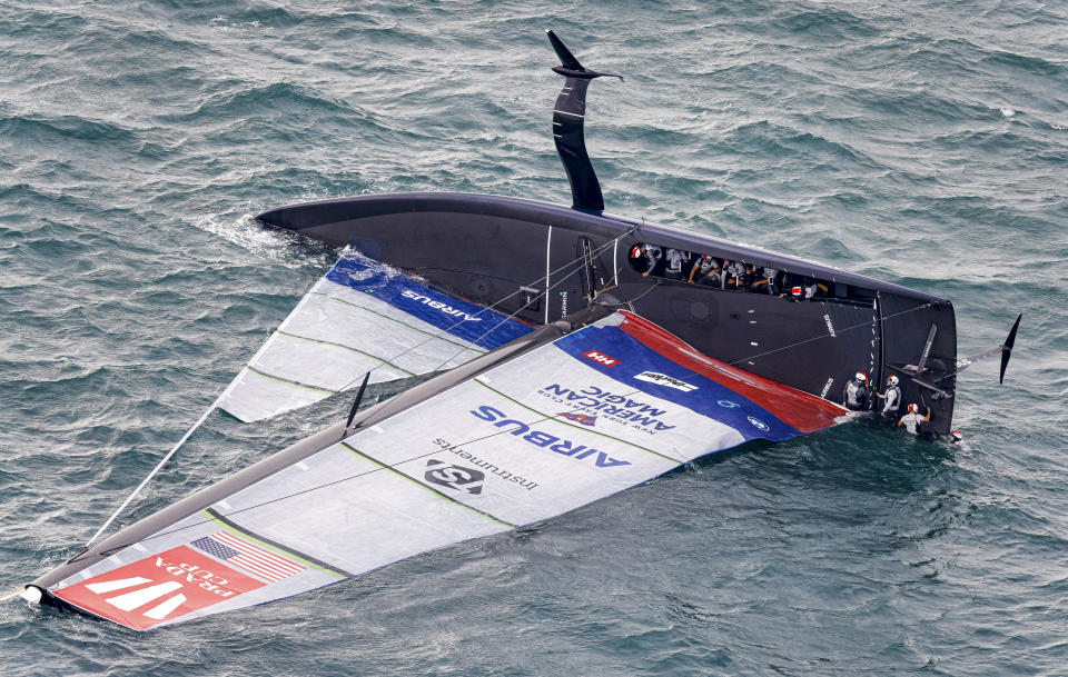 United States' American Magic capsizes during it's race against Italy's Luna Rossa on the third day of racing of the America's Cup challenger series on Auckland's Waitemate Harbour, New Zealand, Sunday, Jan. 17, 2021. (COR 36 Studio Borlenghi via AP)