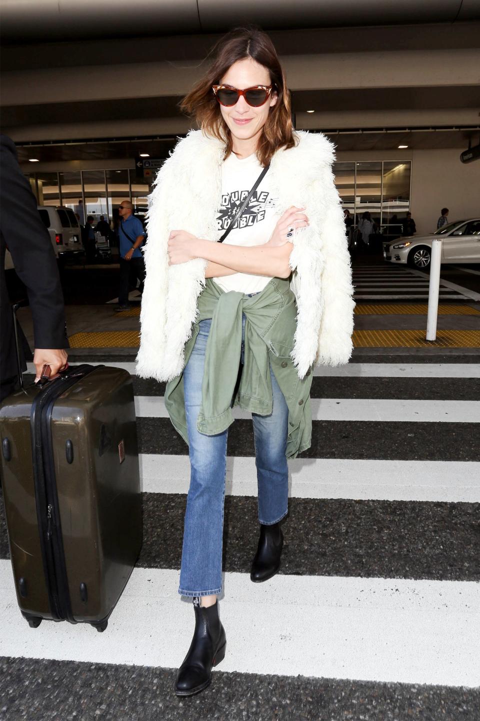 Alexa Chung's cuddly coat is more than a chic outer layer: It can double as a soft pillow on the plane.