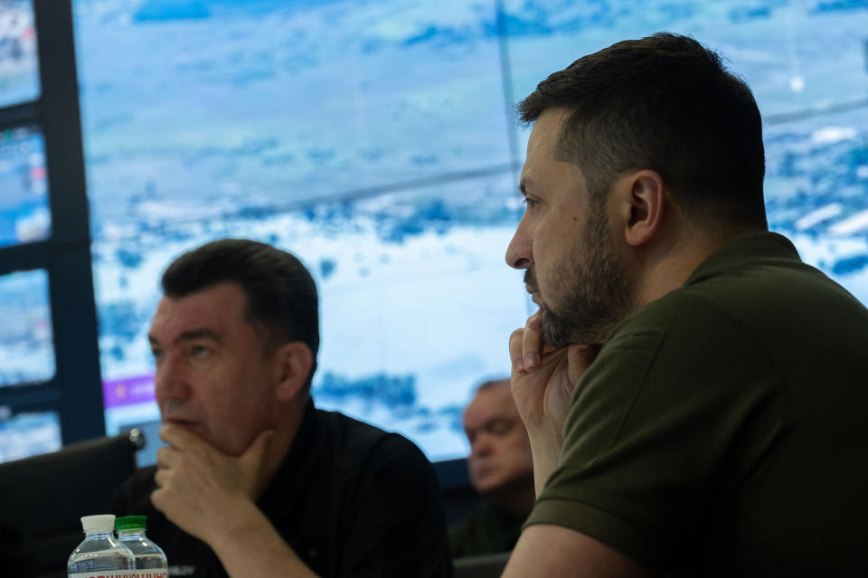 Ukrainian President Volodymyr Zelensky (R) holds an emergency meeting of the National Security and Defense Council on the situation at the Kakhovka after the dam blast overnight, in Kyiv on June 6.<span class="copyright">Ukrainian President Press Office/UPI/Shutterstock</span>