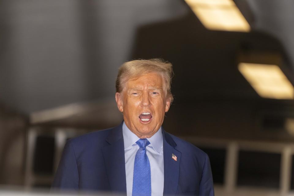 Former President Donald Trump speaks with the media at the end of the day's proceedings in his trial at Manhattan criminal court , Friday, April 26, 2024, in New York. (Mark Peterson/Pool Photo via AP)