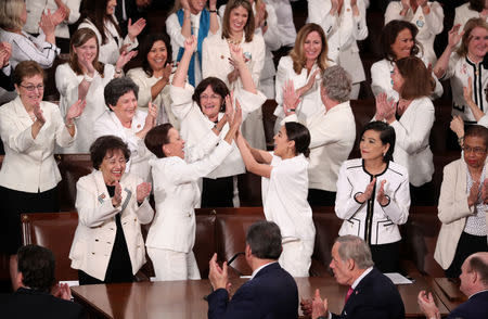 Democratic female members of Congress cheer after President Trump said there are more women in Congress than ever before during his second State of the Union address. REUTERS/Jonathan Ernst