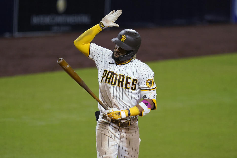 San Diego Padres' Fernando Tatis Jr. hits his bat after striking out during the eighth inning of the team's baseball game against the Los Angeles Angels on Tuesday, Sept. 22, 2020, in San Diego. (AP Photo/Gregory Bull)