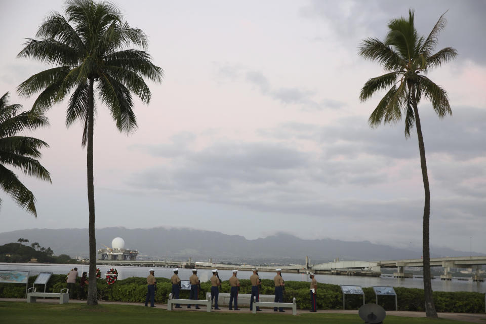 Military members practice ahead of the anniversary ceremony to mark the Japanese attack on Pearl Harbor, Monday, Dec. 7, 2020, in Pearl Harbor, Hawaii. Officials gathered in Pearl Harbor to remember those killed in the 1941 Japanese attack, but public health measures adopted because of the coronavirus pandemic meant no survivors were present. The military broadcast video of the ceremony live online for survivors and members of the public to watch from afar. A moment of silence was held at 7:55 a.m., the same time the attack began 79 years ago. (AP Photo/Caleb Jones, Pool)