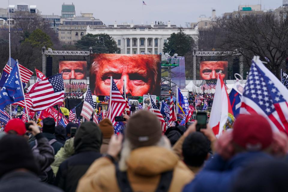 On Jan. 6, 2021, President Donald Trump's face appears on large screens as supporters participate in a rally in Washington. The House committee investigating the Jan. 6 Capitol insurrection, with its latest round of subpoenas in September 2021, may uncover the degree to which Trump, his campaign and White House were involved in planning the rally that preceded the riot, which was billed as a grassroots demonstration.