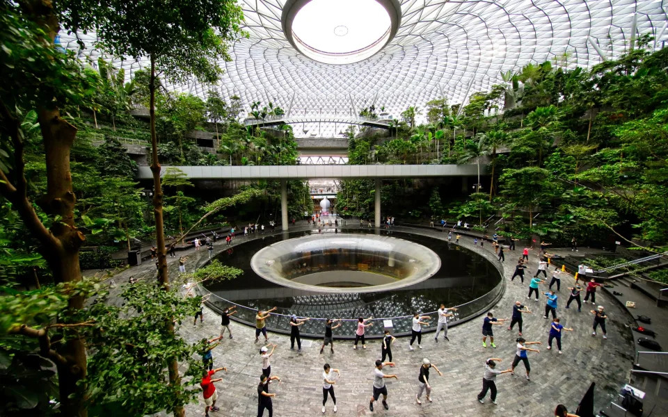 Locals practice qi gong or t’ai qi at Singapore's Botanical Gardens