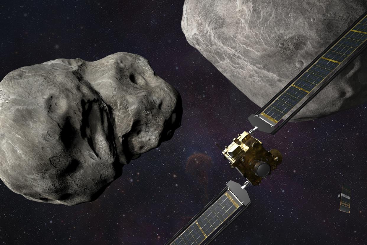 This illustration made available by Johns Hopkins APL and NASA depicts NASA's DART probe, foreground right, and Italian Space Agency's (ASI) LICIACube, bottom right, at the Didymos system before impact with the asteroid Dimorphos, left. DART is expected to zero in on the asteroid Monday, Sept. 26, 2022, intent on slamming it head-on at 14,000 mph. 
