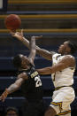 California guard Paris Austin (3) shoots around Colorado guard McKinley Wright IV (25) during the first half of an NCAA college basketball game Thursday, Feb. 27, 2020, in Berkeley, Calif. (AP Photo/D. Ross Cameron)