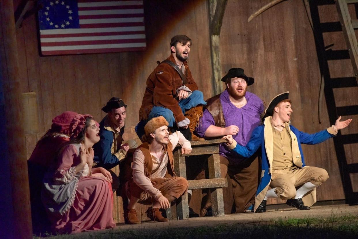 In a scene from Paul Green's "Trumpet in the Land," members of the American Militia, under the direction of Colonel David Williamson, escape the growing violence of the Revolutionary War to enjoy a night of song and dance.