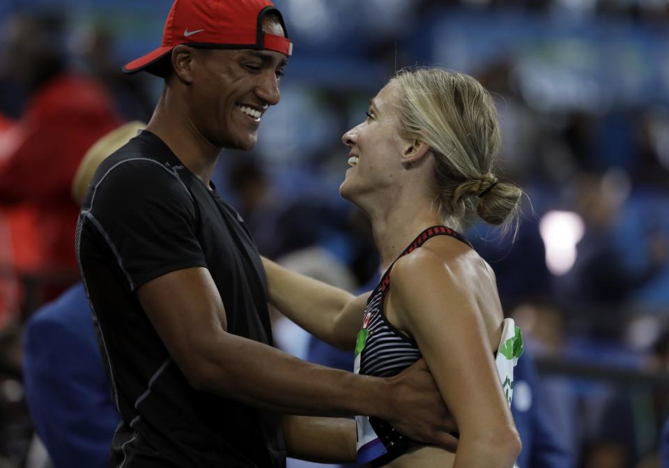 <p>Canada’s Brianne Theisen Eaton is greeted by husband Ashton Eaton after the women’s heptathlon 800-meter heat during the athletics competitions of the 2016 Summer Olympics at the Olympic stadium in Rio de Janeiro, Brazil, Saturday, Aug. 13, 2016. (AP Photo/David J. Phillip) </p>