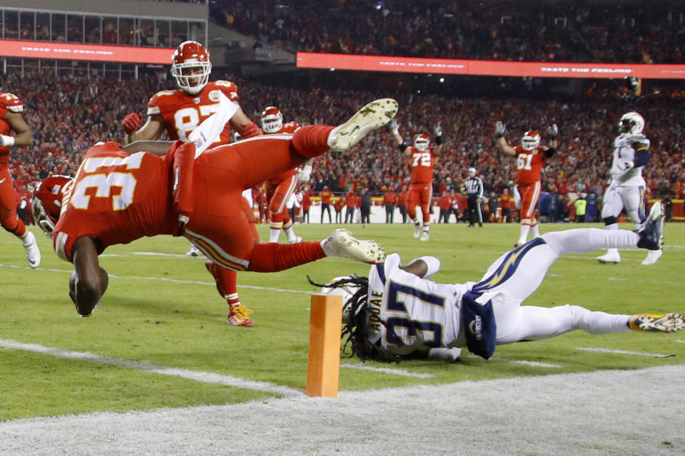 Kansas City Chiefs running back Darrel Williams (31) crosses into the end zone for a touchdown past Los Angeles Chargers safety Jahleel Addae (37) during the first half of an NFL football game in Kansas City, Mo., Thursday, Dec. 13, 2018. (AP Photo/Charlie Riedel)