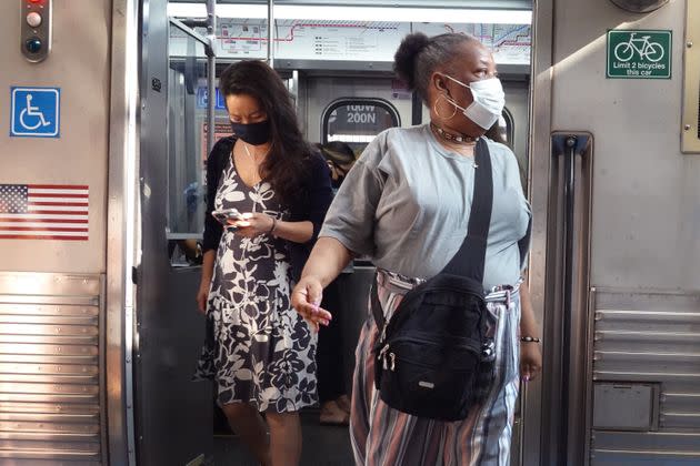 Chicago commuters wear face masks on July 27, 2021. The Centers for Disease Control and Prevention recommends that fully vaccinated people wear face masks indoors again in places with high COVID-19 transmission rates. (Photo: Scott Olson via Getty Images)