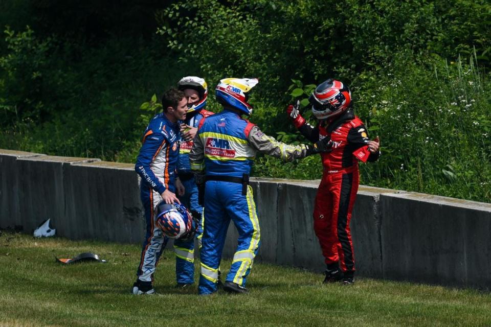 Will Power confronts Scott Dixon after the pair's crash during Saturday morning's IndyCar practice at Road America.