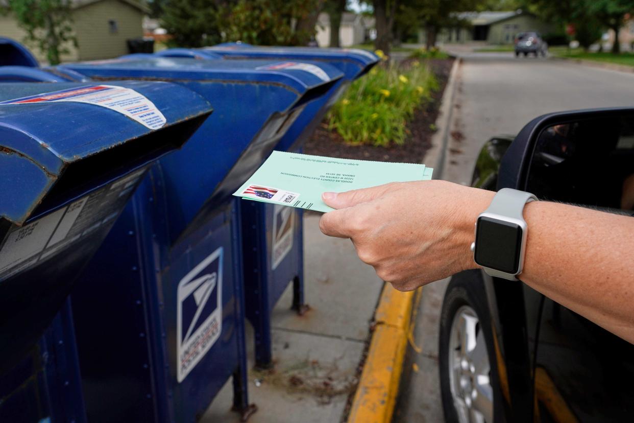 A man applies for a mail-in ballot by sending in forms in 2020.