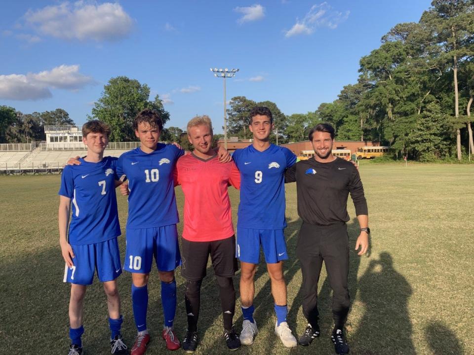 Henry Bush (7), Will Marsden (10), goalkeeper Ethan Bland, Gordon Standing (9) and coach Blake Seale after St. Andrew's beat Brookwood Academy to reach the GISA Final Four.