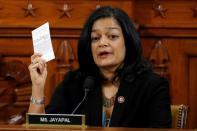 Rep. Pramila Jayapal. D-Wash, holds a copy of the U.S. Constitution as she votes to approve the second article of impeachment against President Donald Trump during a House Judiciary Committee meeting on Capitol Hill, in Washington